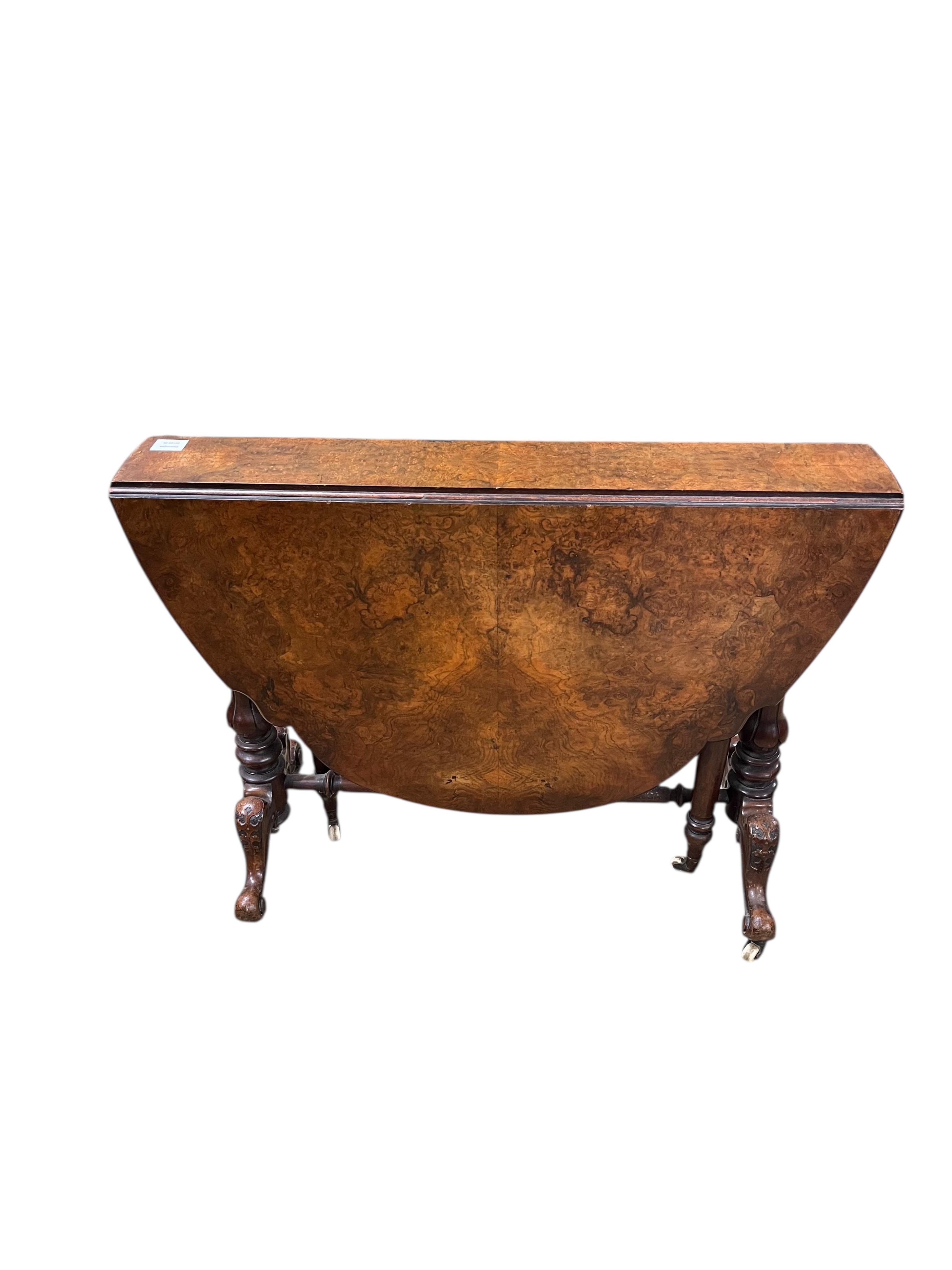 A Victorian walnut Sutherland table, width 92cm, height 68cm